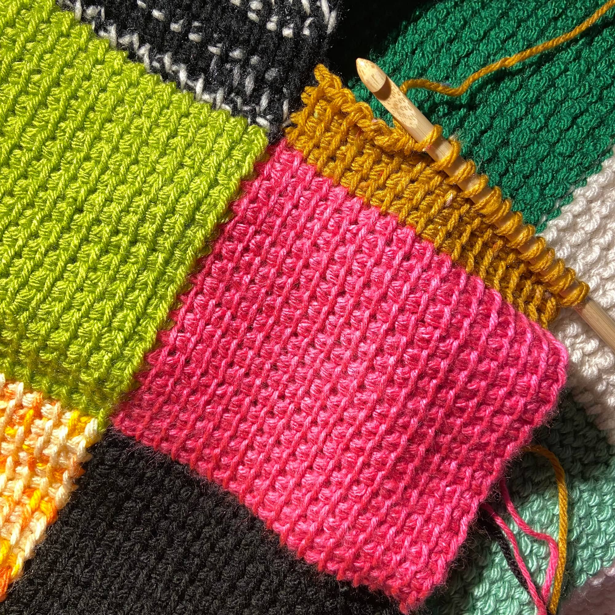 tss_checkerboard_throw.jpga partially worked Tunisian Simple Stitch square joined to a blanket
